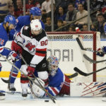 Rangers win 4-3 in OT to end Devils' 11-game road win streak
