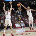 No. 9 Arkansas takes control late, tops UNC Greensboro 65-58