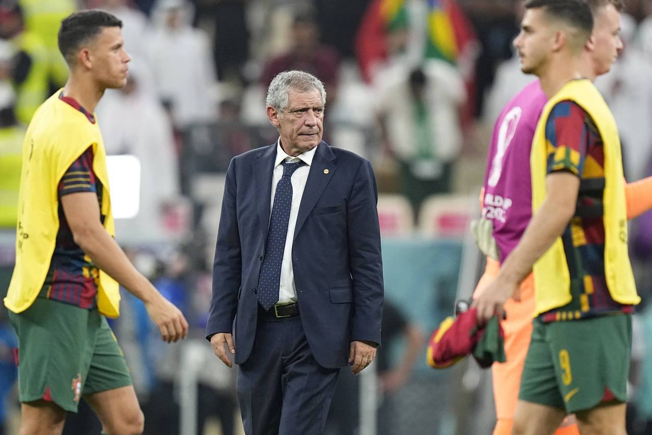 Portugal's head coach Fernando Santos stands at the end of the World Cup round of 16 soccer match b...