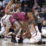 No. 9 UConn wins without Auriemma, topping Florida St 85-77