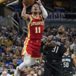 Magic beat Hawks 135-124 for 4th straight victory