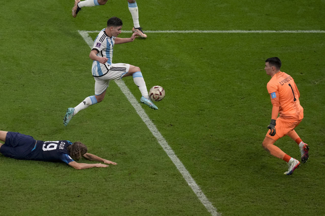 Argentina's Julian Alvarez scores his side's 2nd goal during the World Cup semifinal soccer match b...