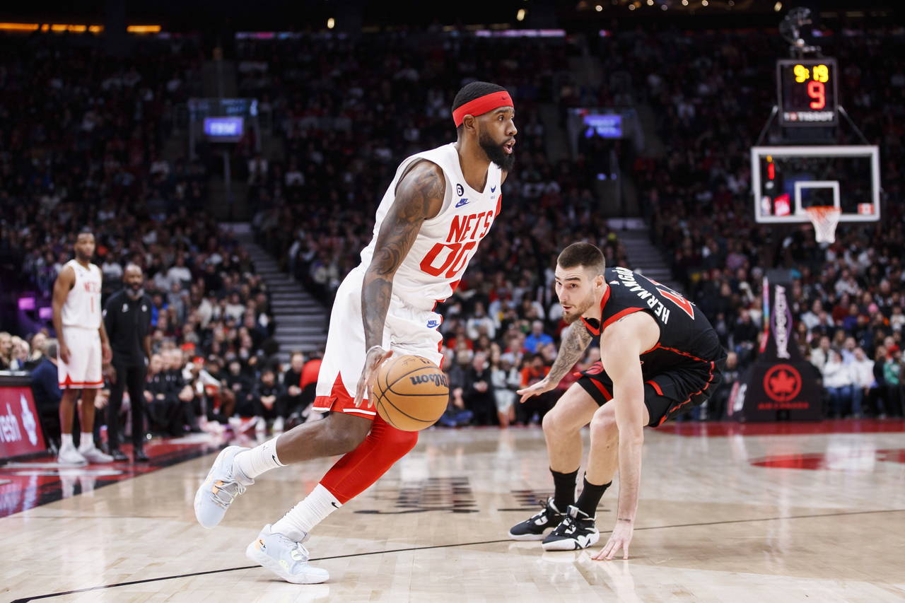 Brooklyn Nets forward Royce O'Neale (00) dribbles against Toronto Raptors forward Juancho Hernangom...