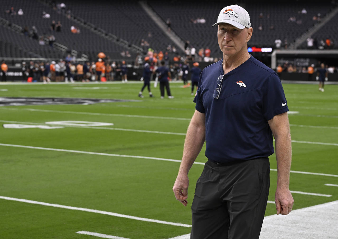 Denver Broncos assistant coach Jerry Rosburg walks around Allegiant Stadium during warm-ups before ...