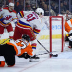 Devils top Flyers, set club mark with 11th straight road win