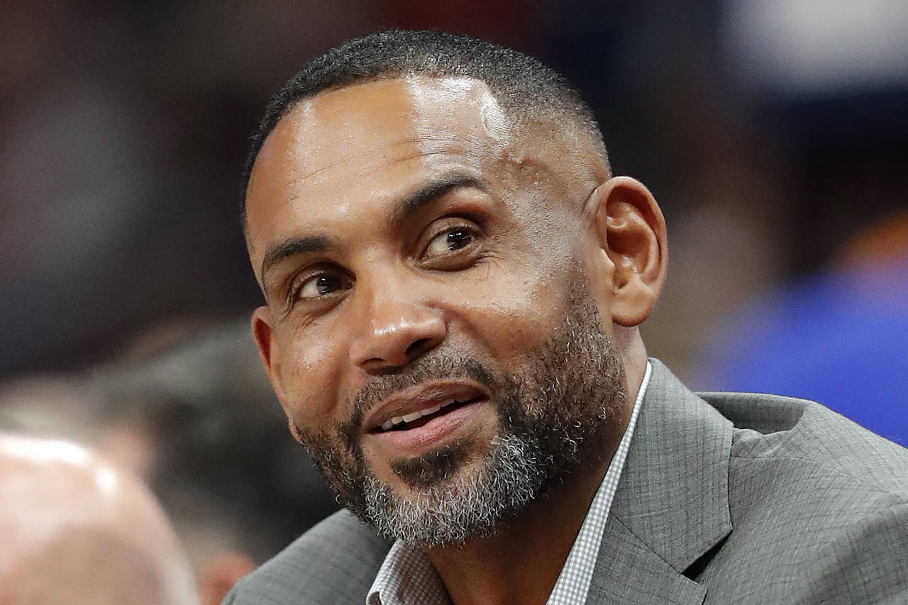 FILE - Atlanta Hawks vice chairman Grant Hill sits court side during the first half of an NBA baske...