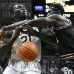 Hawkins leads unbeaten No. 8 UConn past Okla St 74-64