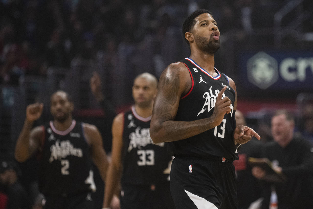 Los Angeles Clippers guard Paul George (13) reacts to his basket during the first half of the team'...