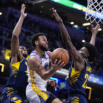 Curry injures shoulder, Pacers hold off Warriors 125-119