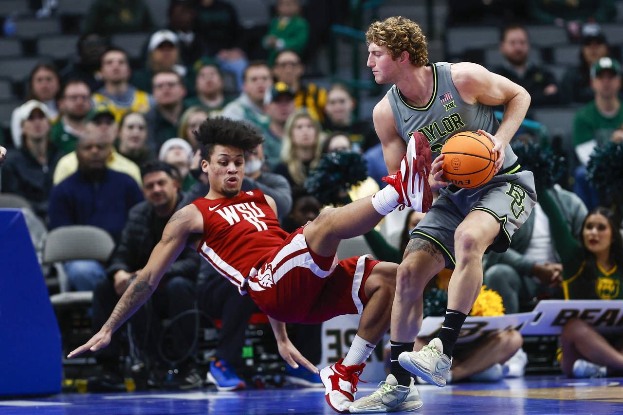 Baylor forward Caleb Lohner (33) fouls Washington State forward DJ Rodman (11) during the second ha...