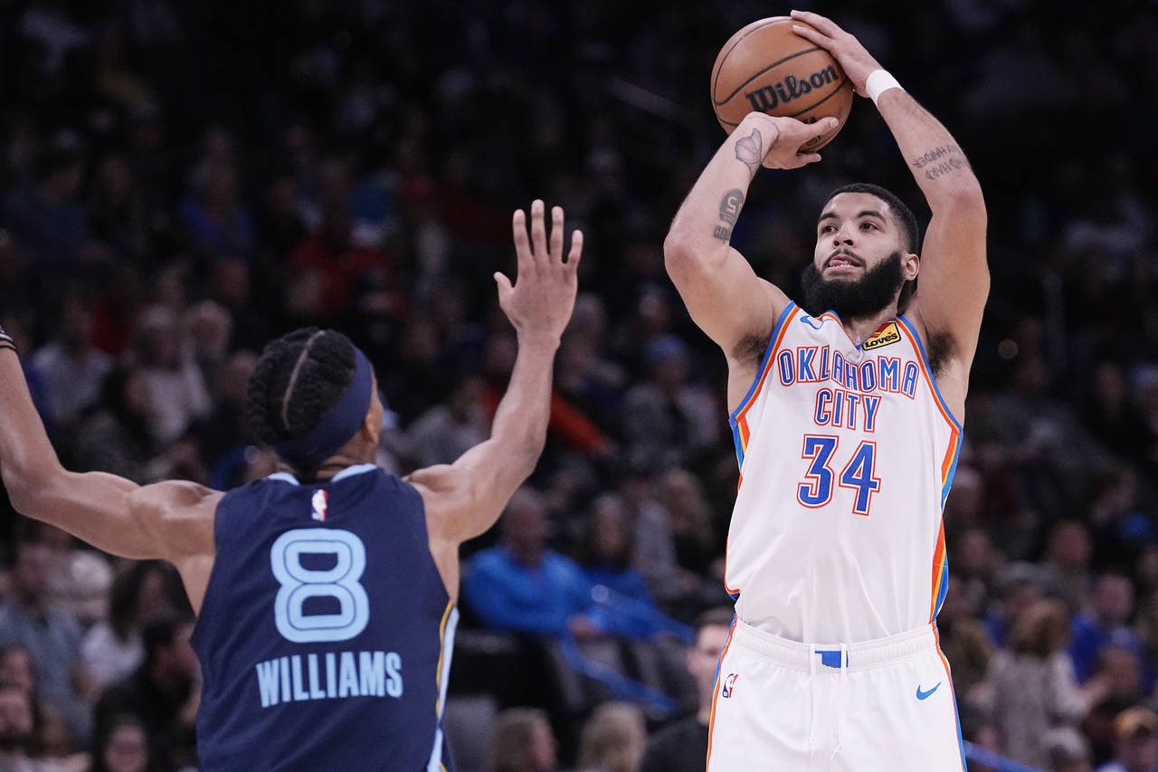 Oklahoma City Thunder forward Kenrich Williams (34) shoots over Memphis Grizzlies forward Ziaire Wi...