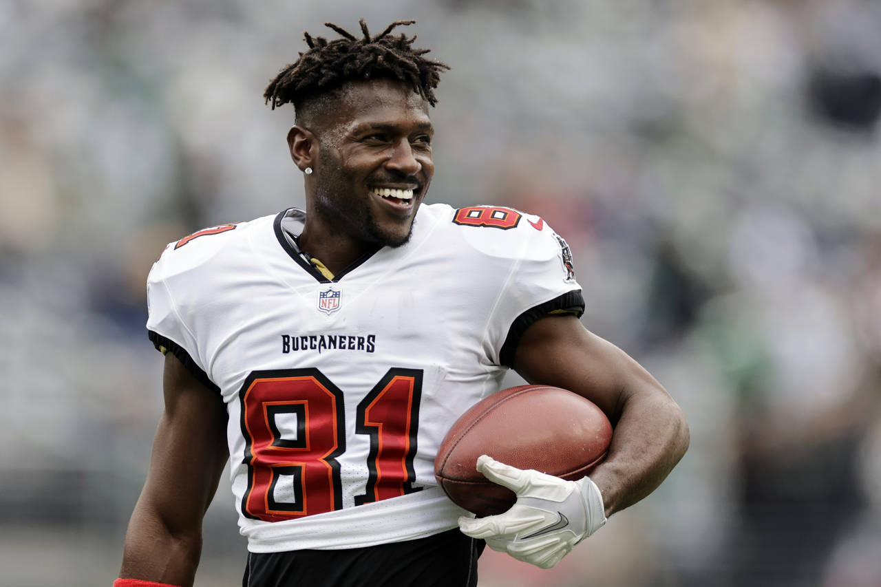 FILE - Tampa Bay Buccaneers wide receiver Antonio Brown (81) walks on the field during an NFL footb...