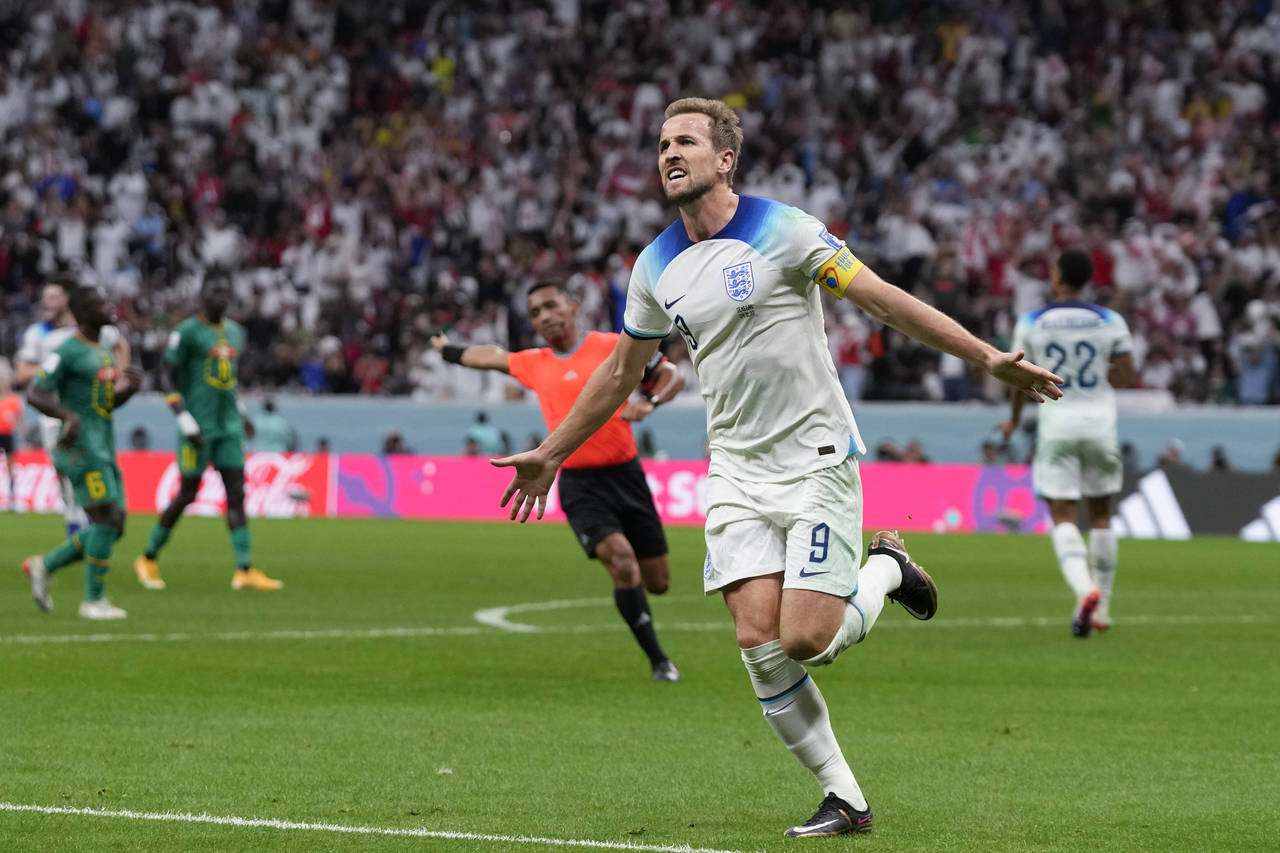 England's Harry Kane celebrates scoring his side's second goal during the World Cup round of 16 soc...