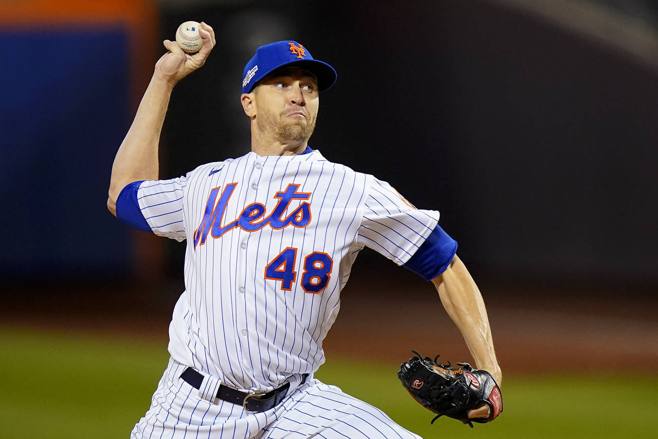FILE - New York Mets starting pitcher Jacob deGrom delivers against the San Diego Padres during the...