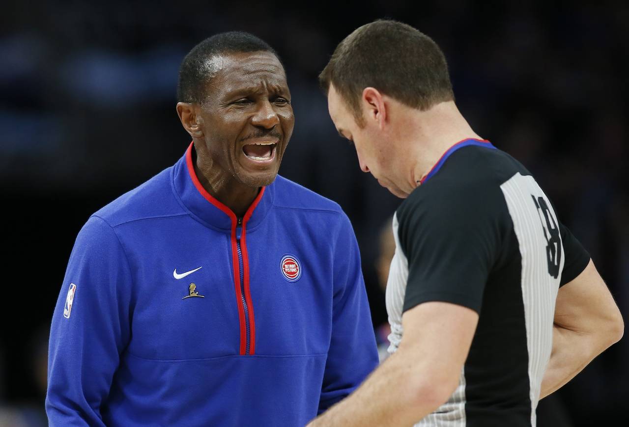 Detroit Pistons head coach Dwane Casey argues with referee Josh Tiven, right, during the second hal...