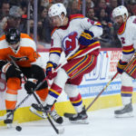 Devils top Flyers, set club mark with 11th straight road win