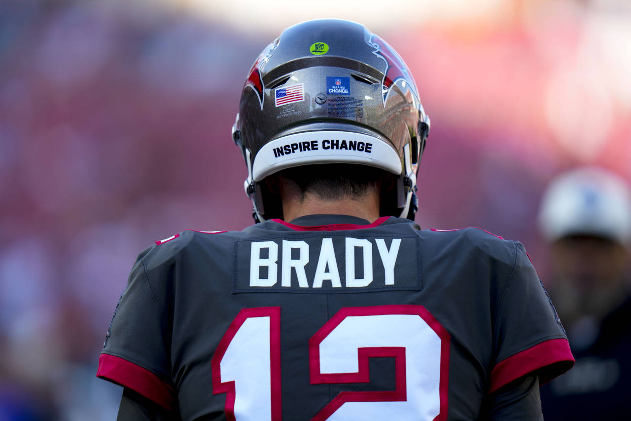 Tampa Bay Buccaneers quarterback Tom Brady (12) warms up before an NFL football game between the Ta...