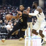 Cavaliers beat Mavericks 100-99 in OT on Allen's slam