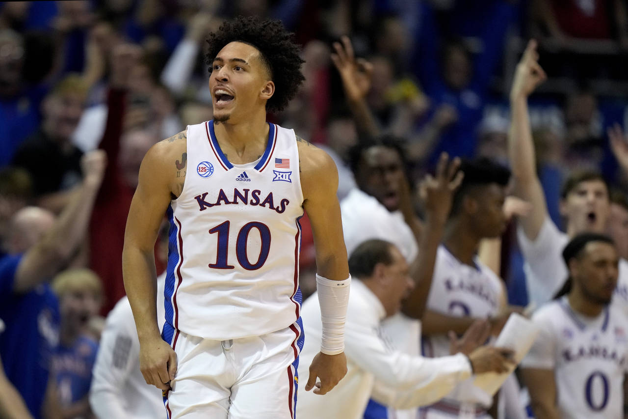 Kansas forward Jalen Wilson (10) celebrates after making a basket during the second half of an NCAA...