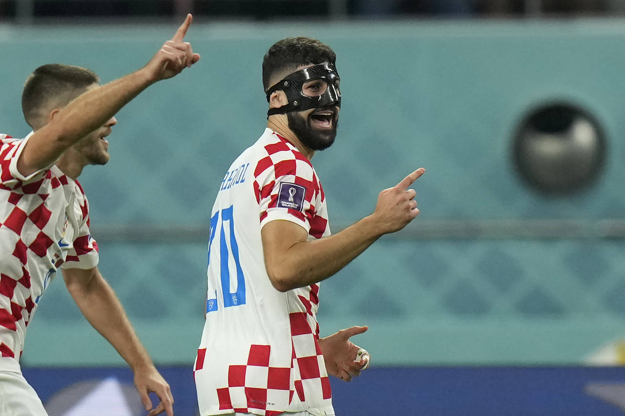Croatia's Josko Gvardiol, right, celebrates after scoring his side's opening goal during the World ...
