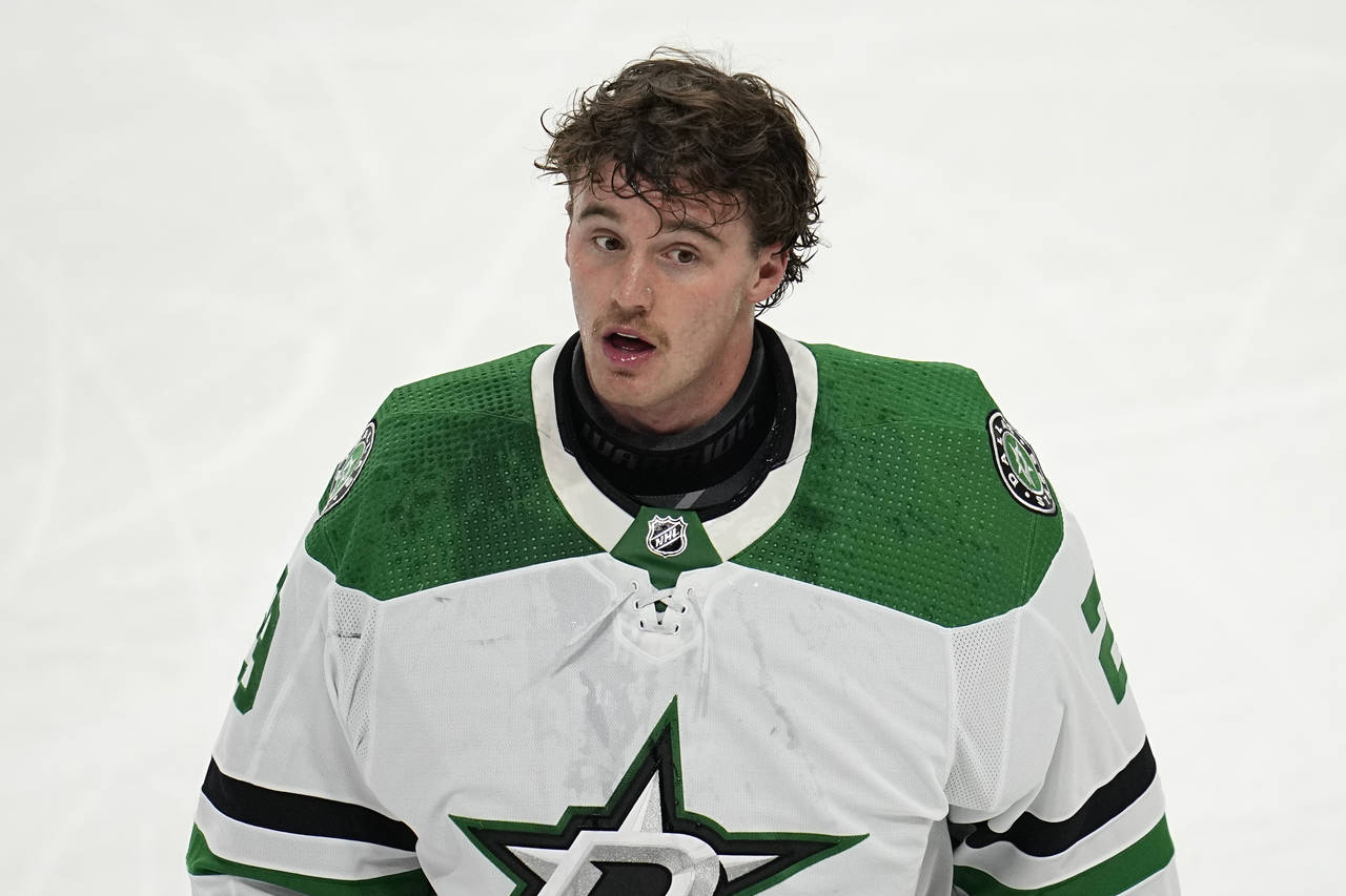Dallas Stars goaltender Jake Oettinger (29) reacts toward the team bench during an ice-cleaning bre...