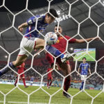 Japan beats Spain 2-1 as both teams advance at World Cup