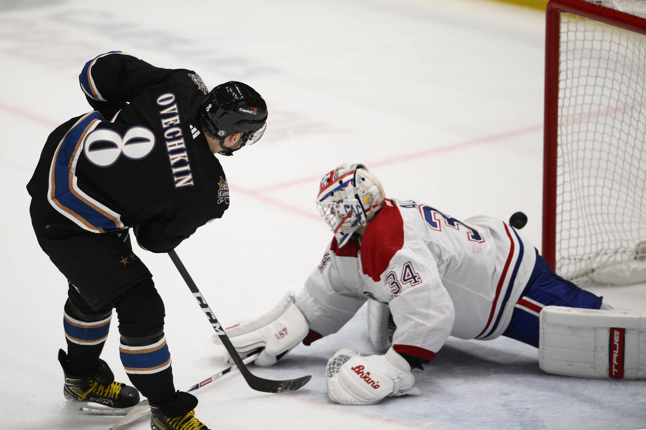 Washington Capitals left wing Alex Ovechkin (8) scores a goal for a hat trick during the third peri...