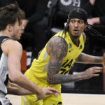 Vassell, Johnson help Spurs hold on to beat Jazz, 126-122