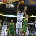 No. 21 UCLA rallies late, hangs on to beat Oregon 65-56