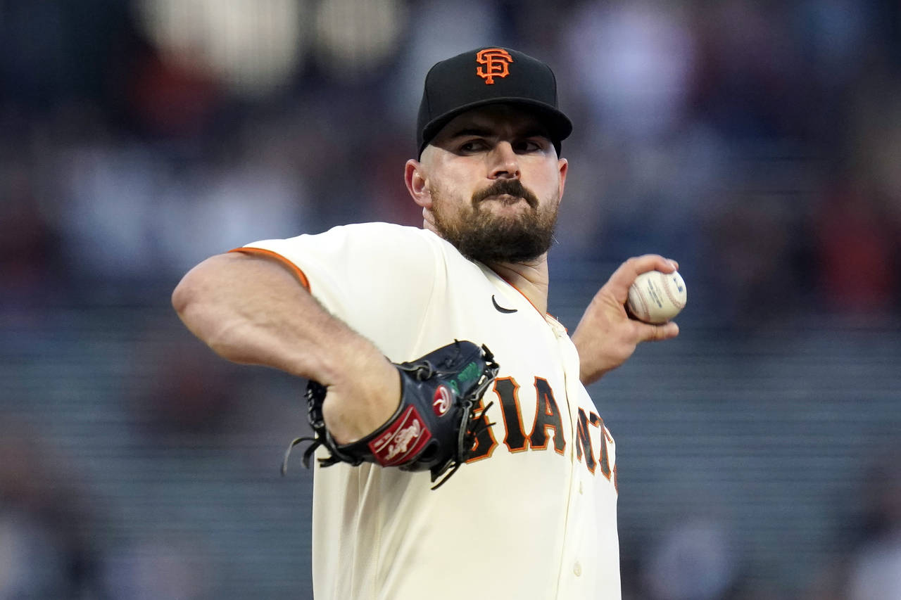 FILE - San Francisco Giants' Carlos Rodón pitches against the Colorado Rockies during the first in...