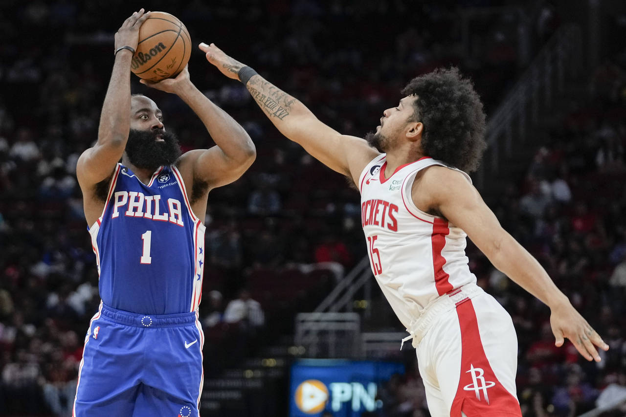 Philadelphia 76ers guard James Harden (1) shoots a three point basket as Houston Rockets guard Dais...