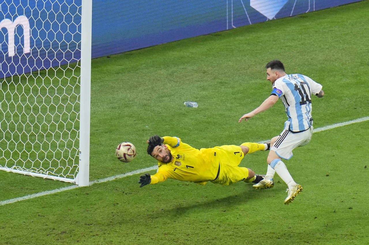 Argentina's Lionel Messi scores his side's 3rd goal during the World Cup final soccer match between...