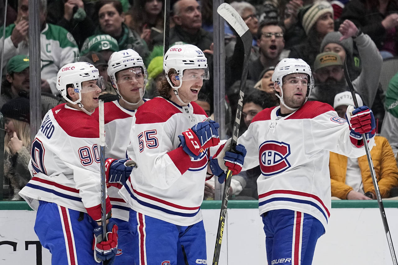 Montreal Canadiens' Michael Pezzetta (55), Anthony Richard (90), Jake Evans (71) and Chris Wideman ...