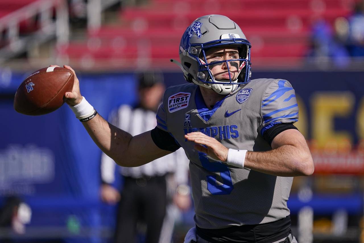 Memphis quarterback Seth Henigan (5) warms up before the First Responder Bowl NCAA college football...