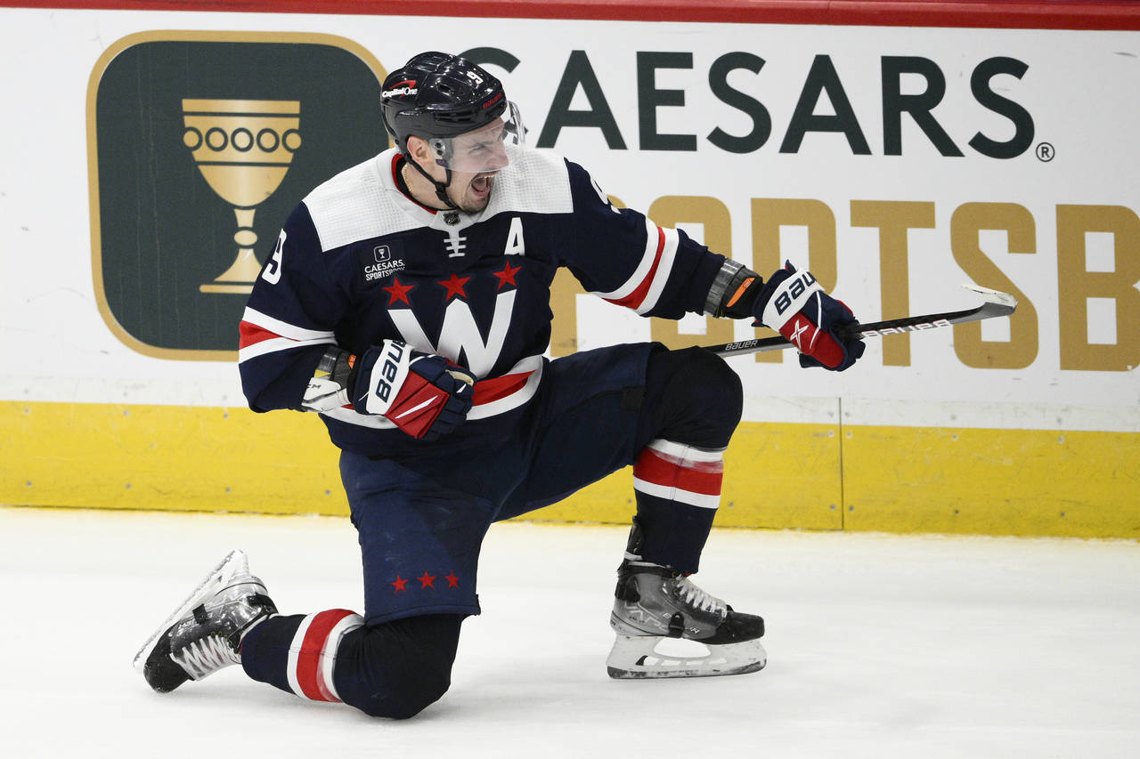 Washington Capitals defenseman Dmitry Orlov celebrates his goal during the overtime of an NHL hocke...