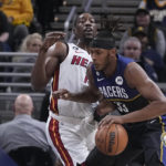 Butler's late flurry helps Heat put away Pacers 87-82