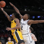 Roach leads No. 15 Duke past Iowa 74-62 in Jimmy V Classic