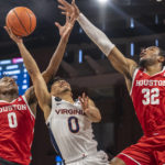 Light week for Top 25 headlined by Virginia-Miami in ACC