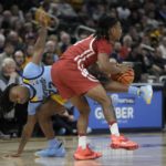 Hepburn paces Wisconsin to 80-77 OT win over Marquette
