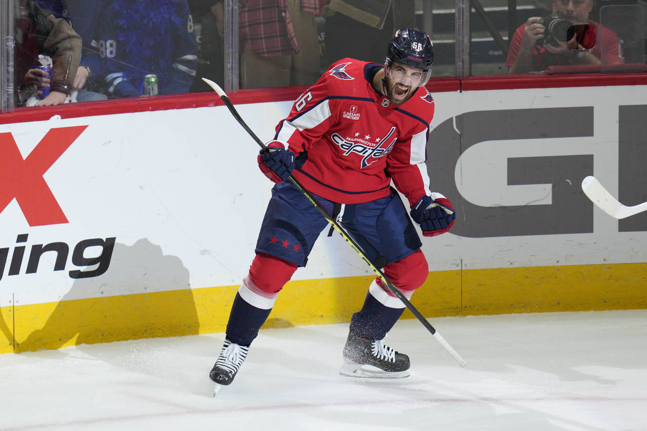 Washington Capitals defenseman Erik Gustafsson (56) celebrates after scoring against the Toronto Ma...
