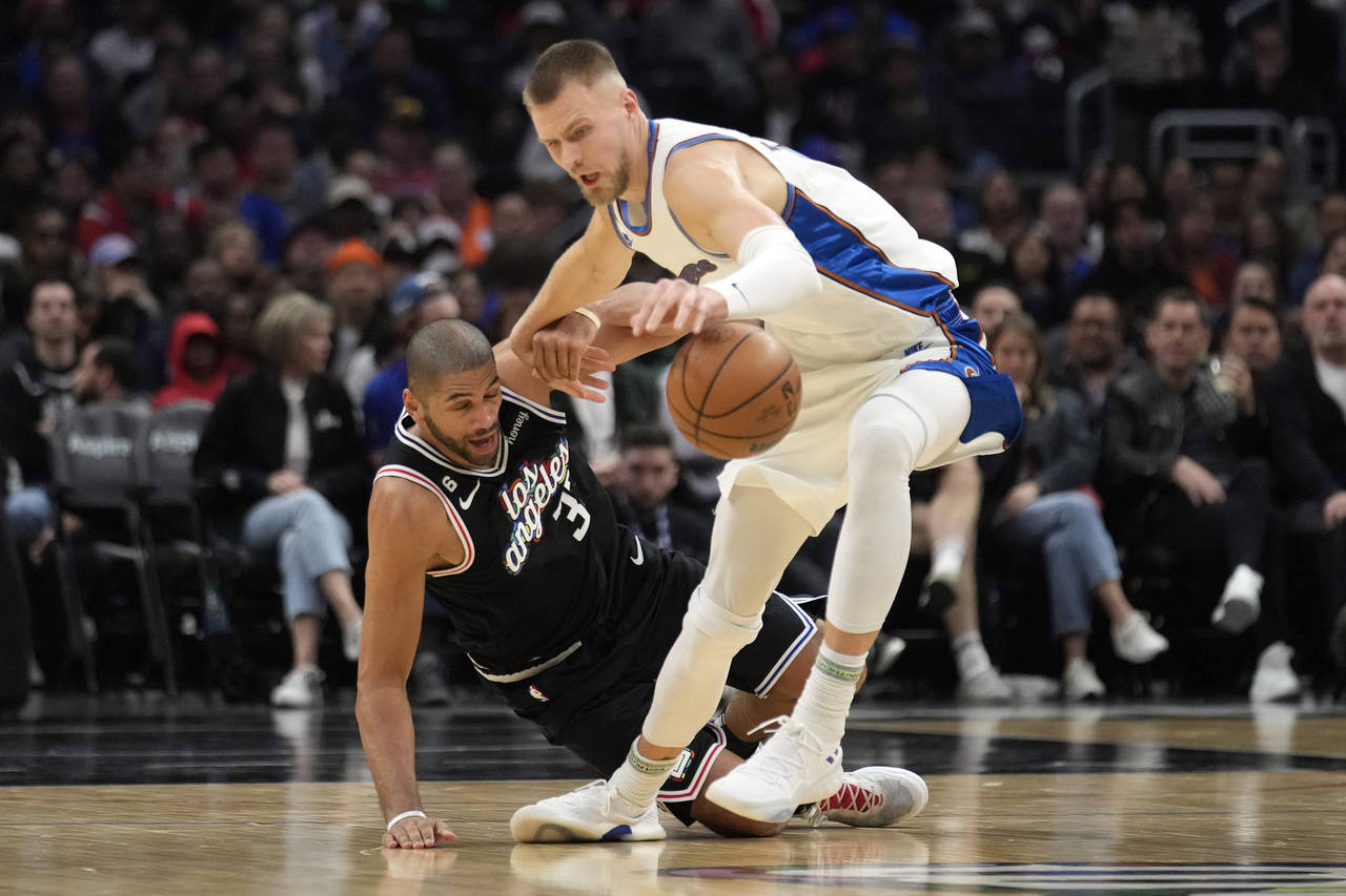 Washington Wizards center Kristaps Porzingis, right, steals the ball from Los Angeles Clippers forw...