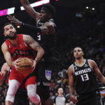 Fox has 27 points and 10 assists, Kings beat Raptors 124-123