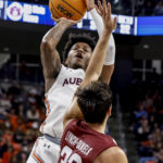 Johnson sharp on 3s, unbeaten No. 15 Auburn beats Colgate