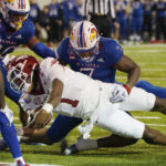 Kansas rallies, but Arkansas wins Liberty Bowl 55-53 in 3OTs