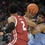 Hepburn paces Wisconsin to 80-77 OT win over Marquette