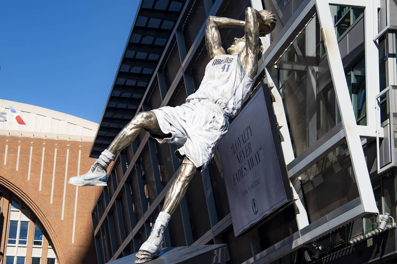 Dirk Nowitzki's statue is unveiled during the "All Four One" statue ceremony in front of the Americ...