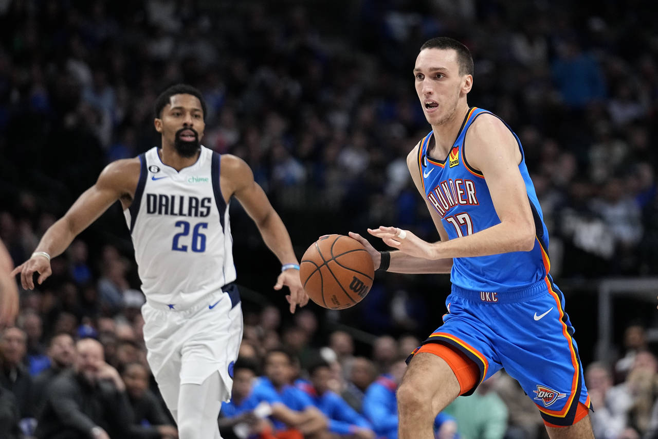 Oklahoma City Thunder forward Aleksej Pokusevski (17) advances the ball as Dallas Mavericks guard S...