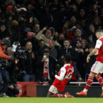 Arsenal fights back to extend league lead to 7 points
