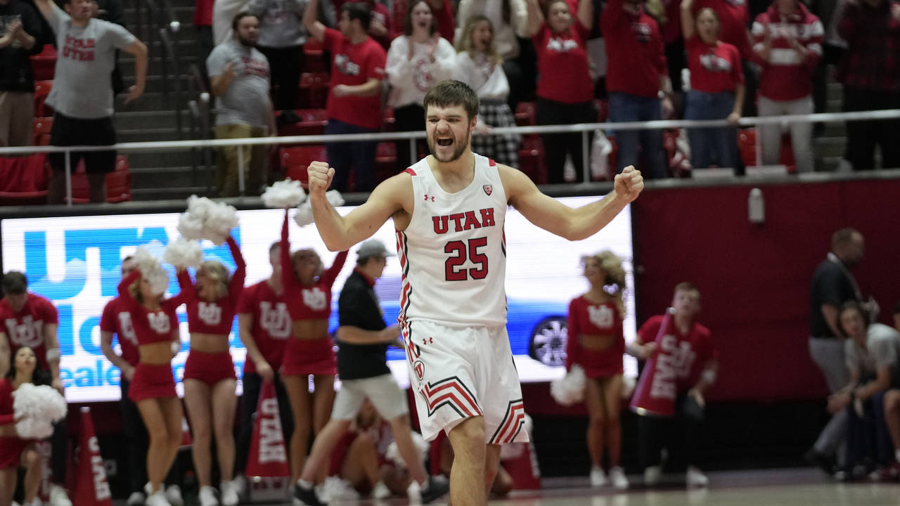Utah guard Rollie Worster (25) reacts after his team scored against Arizona during the second half ...