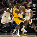 Heat get past Lakers 112-98, climb over .500 at 18-17